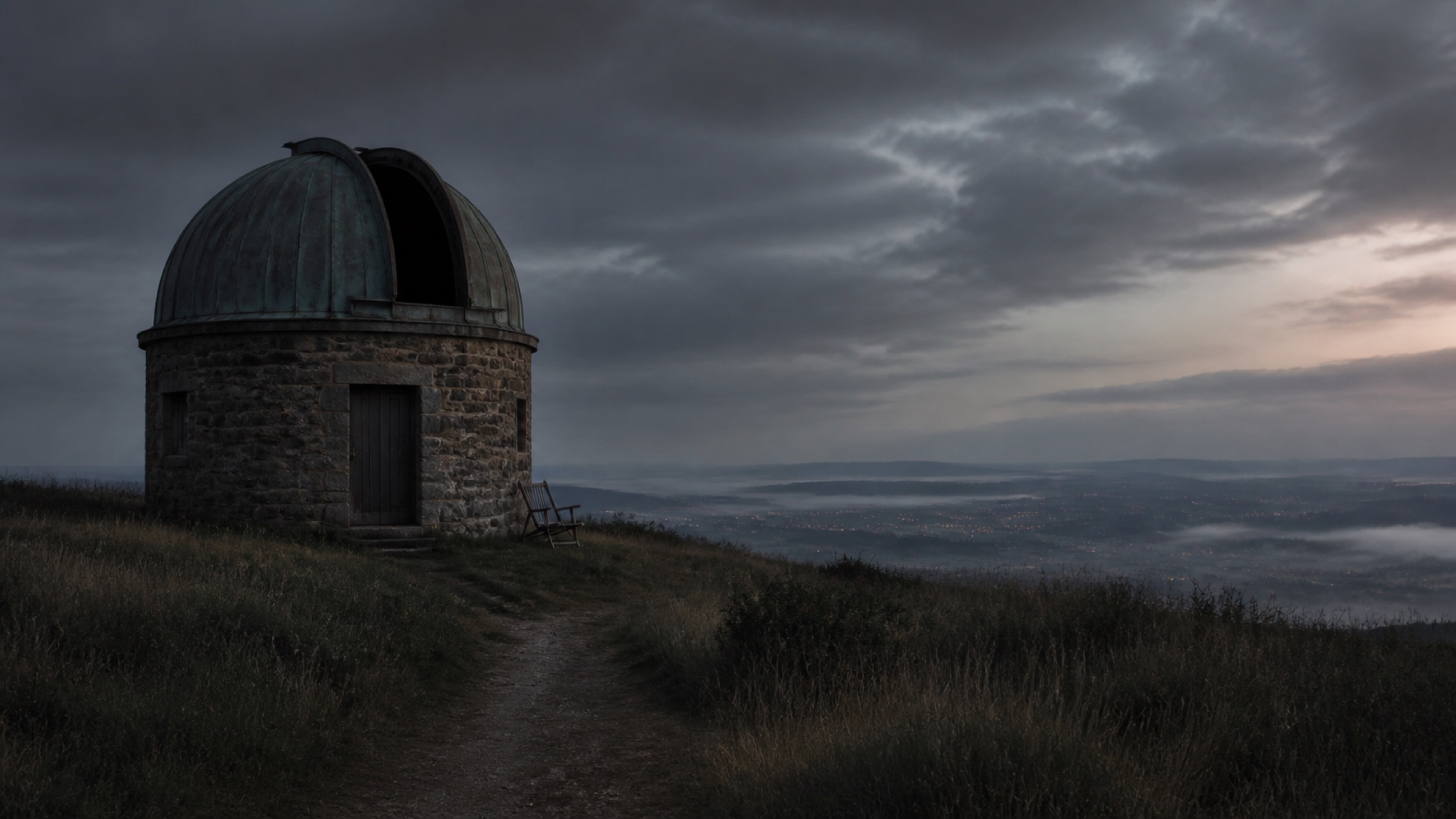 A small hilltop observatory before dawn