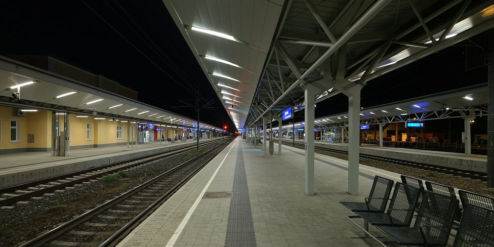 An empty station platform at night