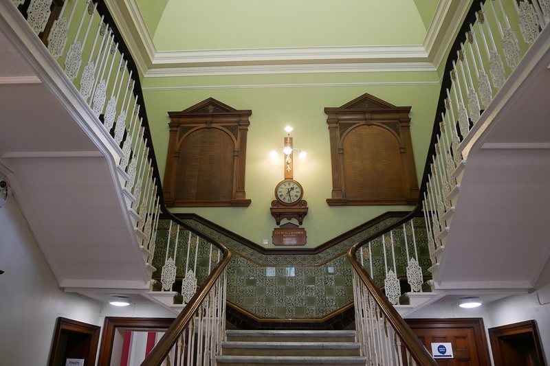 The entrance hall and staircase of an old building